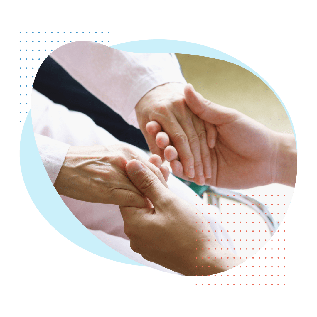A person grabbing an old persons hands